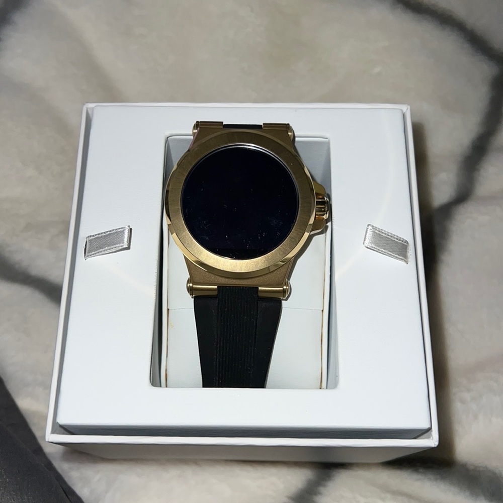 Michael Kors smartwatch. Charger, box, and books included.